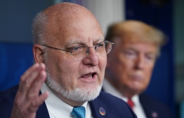 CDC Director Robert R. Redfield speaks as US President Donald Trump listens during the daily briefing on the novel coronavirus, which causes COVID-19, in the Brady Briefing Room of the White House on April 16, 2020, in Washington, DC. (Photo by MANDEL NGAN / AFP)