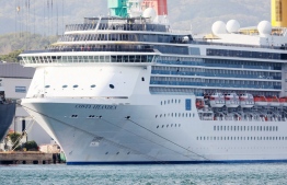 In this picture taken on April 22, 2020, cruise ship Costa Atlantica is docked at a port in Nagasaki. - At least 48 crew aboard a cruise ship docked in the Japanese city of Nagasaki have tested positive for coronavirus, local authorities said on April 23 after confirming 14 additional cases. The Costa Atlantica first arrived in Nagasaki in January to undergo repairs, with around 600 crew on board. PHOTO: STR / JIJI PRESS / AFP