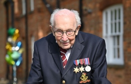 Tom Moore, a 99-year-old British World War II veteran who shot to fame raising millions for health workers fighting the coronavirus has become the oldest artist to reach No. 1 in the UK music singles charts. PHOTO/GETTY IMAGES