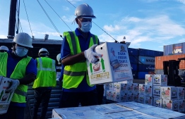 Employees of Maldives Ports Limited clearing out food cargo for deliveries throughout the city as well as for shipments yet to be transported across various atolls. PHOTO: MPL