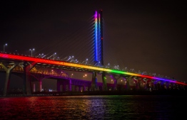 Samuel de Champlain Bridge is illuminated in the colors of the rainbow as a symbol of support during the novel coronavirus pandemic in Montreal, Quebec, Canada, on April 19, 2020. (Photo by Sebastien St-Jean / AFP)