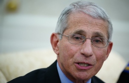 Dr. Anthony Fauci , director of the National Institute of Allergy and Infectious Diseases speaks during a meeting with US President Donald Trump and Louisiana Governor John Bel Edwards D-LA in the Oval Office of the White House in Washington, DC on April 29, 2020. (Photo by MANDEL NGAN / AFP)