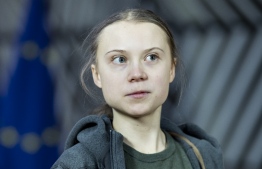 (FILES) In this file photo taken on March 5, 2020 Swedish environmentalist Greta Thunberg arrives for a meeting with EU environment ministers at the Europa Building in Brussels. - Swedish climate activist Greta Thunberg has donated a $100,000 prize she won from a Danish foundation to the United Nations Children's Fund (UNICEF) for use against the COVID-19 pandemic, the world body said on April 30, 2020. (Photo by Kenzo TRIBOUILLARD / AFP)