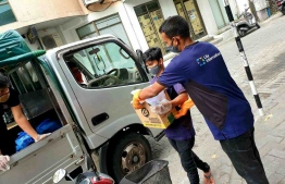 Lily International staff pictured during delivery services, amid the lockdown in capital Male' City. PHOTO/LILY INTERNATIONAL