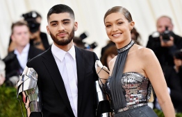 Zayn Malik and Gigi Hadid attend the "Manus x Machina: Fashion In An Age Of Technology" Costume Institute Gala at Metropolitan Museum of Art on May 2, 2016 in New York City. PHOTO: MIKE COPPOLA / GETTY IMAGES / PEOPLE.COM