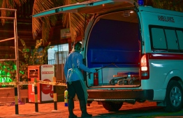 A health worker disinfecting an ambulance deployed in Male' City amid lockdown. FILE PHOTO/MIHAARU