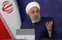 A handout picture provided by the Iranian Presidency on May 3, 2020, shows President Hassan Rouhani chairing a cabinet session in the capital Tehran. - Rouhani said mosques would reopen across large parts of the country tomorrow, after they were closed in early March amid the Middle East's deadliest novel coronavirus outbreak. "Social distancing is more important than collective prayer," he added, arguing that Islam considers safety obligatory, while praying in mosques is only "recommended". PHOTO: IRANIAN PRESIDENCY / AFP