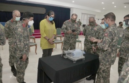 Defence Minister Mariya Ahmed Didi observes the emergency ventilator prototype developed by MNDF. PHOTO/MNDF