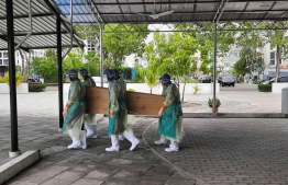 Maldives National Defence Force staff carrying the coffin of the second COVID-19 fatality in Maldives. PHOTO: MNDF