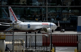 An aircraft of Spanish airlines Air Europa is pictured at the Madrid-Barajas Adolfo Suarez Airport in Barajas on May 5, 2020 amid the national lockdown to prevent the spread of the COVID-19 disease. - More than 70 percent of new virus cases detected in Spain over the past 24 hours have been among medical staff, the health ministry said today. With the epidemic well in remission after peaking over a month ago, Spain has begun moves to ease out of the lockdown following weeks in which the rate of deaths and new infections has steadily declined. (Photo by OSCAR DEL POZO / AFP)