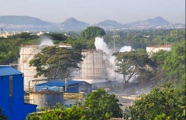 Smokes rise from an LG Polymers plant following a gas leak incident in Visakhapatnam on May 7, 2020. - At least five people have been killed and 1,000 hospitalised after a gas leak at a chemicals plant on the east coast of India, authorities said on May 7, warning the death toll would climb. The gas leaked out of two 5,000-tonne tanks that had been unattended due to India's coronavirus lockdown in place since late March, according to a local police officer. PHOTO: AFP 