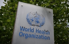 This picture taken on May 12, 2020, shows a sign of the World Health Organization (WHO) in Geneva next to their headquarters, amid the COVID-19 outbreak, caused by the novel coronavirus. PHOTO: AFP
