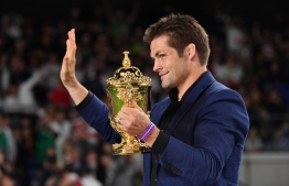 (FILES) This file photo taken on November 2, 2019 shows former New Zealand player Richie McCaw holding the Webb Ellis Cup after the Japan 2019 Rugby World Cup final match between England and South Africa in Yokohama. - McCaw is widely acknowledged as the best player to ever pull on an All Black jersey. (Photo by Kazuhiro NOGI / AFP)