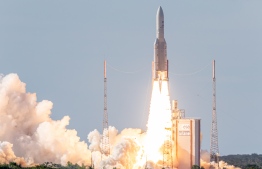 (FILES) In this file photo taken on August 06, 2019 an Ariane 5 carrying two telecommunications satellites, Intelsat 39, built by Space Systems/Loral, and EDRS-C, built by OHB System, lifts off from its launchpad in Kourou, at the European Space Center in French Guiana. - Global satellite operator Intelsat filed for bankruptcy protection on May 14, 2020, citing disruption from to its business from the virus pandemic, in a move aimed at restructuring its operations. (Photo by jody amiet / AFP)