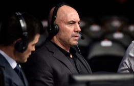 Joe Rogan is seen in the commentary booth during the UFC 220 event at TD Garden on January 20, 2018 in Boston, Massachusetts. PHOTO: GETTY IMAGES