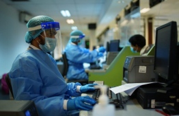 (FILE) MACL staff working in PPE in May, 2020: the salary increment will not affect foreign employees with in high management positions -- Photo: MACL