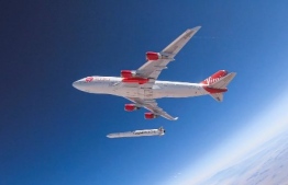This handout photo obtained May 25, 2020 courtesy of Virgin Orbit shows Cosmic Girl as it releases LauncherOne mid-air for the first time during a July 2019 drop test. - Small satellite launcher Virgin Orbit ó the sibling company to Richard Bransonís space tourism venture Virgin Galactic ó plans to conduct the first test launch of its rocket May 25, 2020. The company has been developing and testing its vehicles for the last six years, but now itís ready to finally send a rocket to orbit. (Photo by Handout / Virgin Orbit / AFP) / 