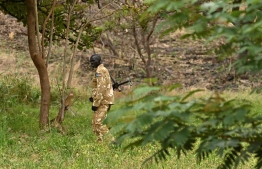 A game warden patrols at the Boma National Park in eastern South Sudan on February 4, 2020. - South Sudan holds enormous ecotourism potential, boasting Africa's largest savanna and wetland, the second-largest mammal migration on earth, and the lions, elephants and myriad other endangered and iconic species that have long lured visitors to the continent. (Photo by TONY KARUMBA / AFP)
