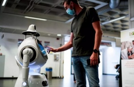 The robot greeting patients and taking temperatures at Antwerp University Hospital. PHOTO: AFP