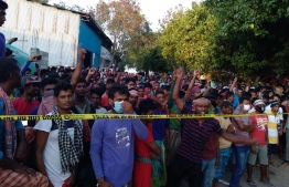 Migrant workers employed at the local construction company protesting in Thilafushi. Police revealed that 133 expats were arrested after the protests escalated into clashes, injuring two Policemen. PHOTO: MIHAARU FILES