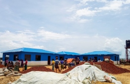 Rohingya refugees work to build a quarantine centre at the Kutupalong refugee camp in Ukhia on June 4, 2020. - Rohingya refugees are so fearful of failing coronavirus tests that they have fled isolation centres in camps in Bangladesh where the first death of one of the Muslim outcasts has heightened nerves over the spread of the pandemic, according to community leaders. About one million Rohingya, most of whom fled a military crackdown in Myanmar in 2017, are packed into camps along the Bangladesh border where the coronavirus is the latest cause of panic. (Photo by MOHAMMAD KALAM / AFP)