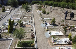 A view shows the Muslim section of an overwhelmingly Roman Catholic cemetery of Bruzzano, on the outskirts of Milan, on June 5, 2020. - Like so many others, Italy's Muslim community was not spared the coronavirus that took thousands of lives in recent months. But compounding the pain for the country's religious minority has been the recognition of a grim reality - the lack of space to bury their dead. (Photo by Miguel MEDINA / AFP)