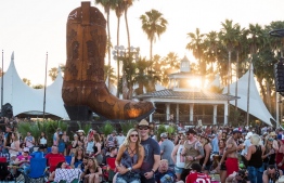 (FILES) In this file photo taken on April 30, 2017 fans fans react to performances at the 2017 Stagecoach Country Music Festival at the Empire Polo Club in Indio, California. - The 2020 Coachella and Stagecoach music festivals have been cancelled after initially being postponed to October 2020 amid the novel coronavirus pandemic, US media reported on June 10, 2020. (Photo by Robyn Beck / AFP)