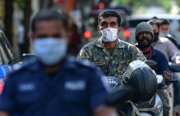 Motorcyclists are seen driving on a street on capital city Male' amid the ongoing COVID-19 outbreak in the country. PHOTO: NISHAN ALI / MIHAARU