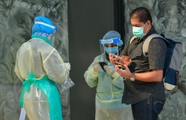 Health professionals collecting random samples on the roads of capital Male', following the easing of lockdown measures for the 'new normal'. Maldives is amongst one of the Commonwealth countries fighting against COVID-19. PHOTO: NIISHAN ALI