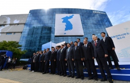 (FILES) In this file photo taken on September 14, 2018, South and North Korean officials attend an opening ceremony of a joint liaison office in Kaesong. - North Korea blew up an inter-Korean liaison office on its side of the border on June 16, 2020, the South's Unification ministry said, after days of increasingly virulent rhetoric from Pyongyang. (Photo by - / KOREA POOL / AFP) / 