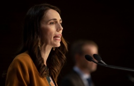 New Zealand's Prime Minister Jacinda Ardern speaks during a press conference about the COVID-19 coronavirus at Parliament in Wellington on June 8, 2020. While the rest of the world struggled with mounting numbers, additional lockdowns and 2nd/3rd waves, thanks to their immediate and efficient response, New Zealand recorded no active COVID-19 cases after the country's final patient was given the all clear and released from isolation, health authorities said on June 8. Many credit the country's successful control of the disease and its spread to Prime Minister Jacinda's science and expert-led, "swift and tough" strategies as well as her teams "effective, empathetic and thorough" communication (Quotes from Deutsche Welle / Germany). PHOTO: Marty MELVILLE / AFP