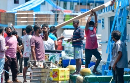 Cargo being loaded onto a boat in the capital city of Male'. PHOTO: NISHAN ALI/ MIHAARU