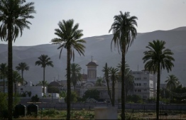A picture taken on June 21, 2020, shows a view of a christian church in the West Bank city of Jericho. - When Israeli Prime Minister Benjamin Netanyahu unveiled a map of his plans in September, he pointed to a long blue zone to be annexed, leaving a brown speck in the middle: Jericho. Now the city's farmers in the occupied West Bank fear being marooned on a scrap of Palestinian land if Israel forges ahead with its plans to annex the Jordan Valley. (Photo by ABBAS MOMANI / AFP)