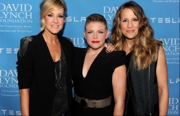 (FILES) In this file photo taken on February 27, 2014 (L-R) musicians Martie Maguire, Natalie Maines and Emily Robison of the Dixie Chicks arrive at the David Lynch Foundation Gala Honoring Rick Rubin at the Beverly Wilshire Hotel on in Beverly Hills, California. - The country trio Dixie Chicks are now simply The Chicks, dropping a nickname for the Confederate-era South from their band name. The stealthy switch saw the group amend their social media usernames and release a new song and accompanying video "March March" on June 25, 2020. (Photo by KEVIN WINTER / GETTY IMAGES NORTH AMERICA / AFP)