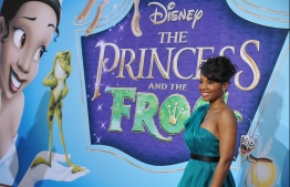 (FILES) In this file photo actress Anika Noni Rose, the voice of Princess Tiana (at left on the poster), poses as she arrives for the world premiere screening of Disney's "The Princess and The Frog," at Walt Disney Studios in Burbank, California on November 15, 2009, Princess Tiana is Disney's first African-American princess. - "Splash Mountain" rides at Disney theme parks will be rebranded with a film featuring the company's first black princess, it said June 25, 2020, after petitions drew attention to the log flume's racist history.The popular "Splash Mountain" attractions at Disneyland and Disney World are based on the controversial 1946 film "Song of the South" -- a movie long accused of peddling racist tropes about the post-Civil War South. (Photo by Robyn BECK / AFP)