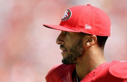 (FILES) In this file photo taken on August 16, 2014 Quarterback Colin Kaepernick #7 of the San Francisco 49ers looks on during a preseason game against the Denver Broncos at Levi's Stadium in Santa Clara, California. - Former NFL star Colin Kaepernick, who launched kneeling protests during US national anthems to protest police brutality and racial injustice, will be the subject of a six-part series, Netflix announced June 29, 2020. (Photo by EZRA SHAW / GETTY IMAGES NORTH AMERICA / AFP)
