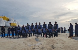 Police officers during the operation on B. Bodufinolhu to deescalate the situation after expatriate workers held local staff captive, protesting over six months of unpaid salaries. PHOTO/POLICE