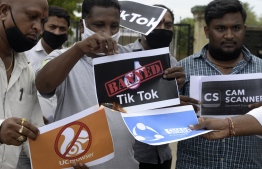 Members of the City Youth Organisation hold posters with the logos of Chinese apps in support of the Indian government for banning the wildly popular video-sharing 'Tik Tok' app, in Hyderabad on June 30, 2020. - TikTok on June 30 denied sharing information on Indian users with the Chinese government, after New Delhi banned the wildly popular app citing national security and privacy concerns.
"TikTok continues to comply with all data privacy and security requirements under Indian law and have not shared any information of our users in India with any foreign government, including the Chinese Government," said the company, which is owned by China's ByteDance. (Photo by NOAH SEELAM / AFP)