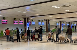 Bangladeshi expatriates at Velana International Airport awaiting their repatriation flight. PHOTO: MALDIVIAN