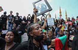 Members of the Oromo Ethiopian community in Lebanon take part in a demonstration to protest the death of musician and activist Hachalu Hundessa, in the capital Beirut on July 5, 2020. - Hundessa was shot and killed in the Ethiopian capital Addis Ababa on June 29, 2020. His death has sparked ongoing protests around the world. (Photo by ANWAR AMRO / AFP)