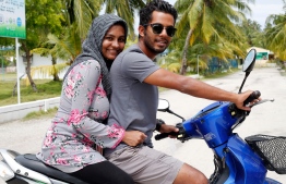 A Maldivian couple on a motorcycle. PHOTO:  ASHWA FAHEEM/UNFPA MALDIVES