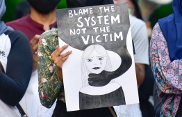 A poster by demonstrators protesting against rape and sexual assault. PHOTO: MIHAARU