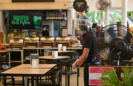 A restaurant staff wearing protective gear as a precautionary measure against COVID-19 as Maldives transitions to the 'new normal'. The Health Protection Agency (HPA) announced that a mass inspection will be conducted to ensure that offices and service providers are adhering to the agency's guidelines. PHOTO: MIHAARU