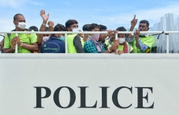 Maldives Police Service transferring the migrant workers arrested from the demonstration staged by employees of Island Expert Pvt Ltd on a police vehicle. PHOTO: NISHAN ALI/ MIHAARU