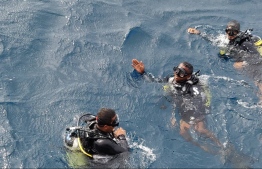 Divers of Maldives National Defence Force (MNDF), searching for Ali Shah, reported missing during the early hours of Saturday. PHOTO: MNDF