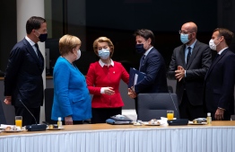(LtoR) Dutch Prime Minister Mark Rutte, German Chancellor Angela Merkel, European Commission President Ursula von der Leyen, Italy's Prime Minister Giuseppe Conte, European Council President Charles Michel and French President Emmanuel Macron speak together ahead of an EU summit at the European Council building in Brussels, on July 18, 2020, as the leaders of the European Union hold their first face-to-face summit over a post-virus economic rescue plan. - The EU has been plunged into a historic economic crunch by the coronavirus crisis, and EU officials have drawn up plans for a huge stimulus package to lead their countries out of lockdown. (Photo by Francisco Seco / POOL / AFP)