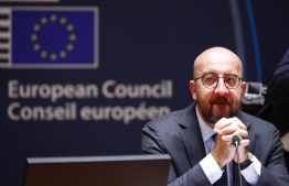 President of the European Council Charles Michel looks on as he attends an EU summit at the European Council building in Brussels, on July 18, 2020, as the leaders of the European Union hold their first face-to-face summit over a post-virus economic rescue plan. - The EU has been plunged into a historic economic crunch by the coronavirus crisis, and EU officials have drawn up plans for a huge stimulus package to lead their countries out of lockdown. (Photo by FRANCOIS LENOIR / POOL / AFP)