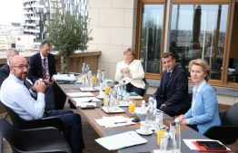 President of the European Council Charles Michel (L), Germany's Chancellor Angela Merkel (C), France's President Emmanuel Macron (2 nd R) and President of the European Commission Ursula von der Leyen talks during a bilateral meeting at the EU summit on a coronavirus recovery package at the European Council building in Brussels on July 19, 2020 An acrimonious EU summit headed into a third day as leaders remained deadlocked over a huge post-coronavirus economic recovery plan, unable to overcome fierce resistance from the Netherlands and its "frugal" allies.
François WALSCHAERTS / POOL / AFP