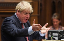 A handout photograph released by the UK Parliament shows Britain's Prime Minister Boris Johnson during Prime Minister's Questions (PMQs) in the House of Commons in London on July 15, 2020. (Photo by JESSICA TAYLOR / various sources / AFP) / 