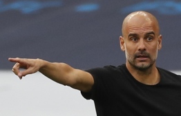 Manchester City's Spanish manager Pep Guardiola gestures from the touchline during the English FA Cup semi-final football match between Arsenal and Manchester City at Wembley Stadium in London, on July 18, 2020. (Photo by MATTHEW CHILDS / POOL / AFP) / NOT FOR MARKETING OR ADVERTISING USE / RESTRICTED TO EDITORIAL USE